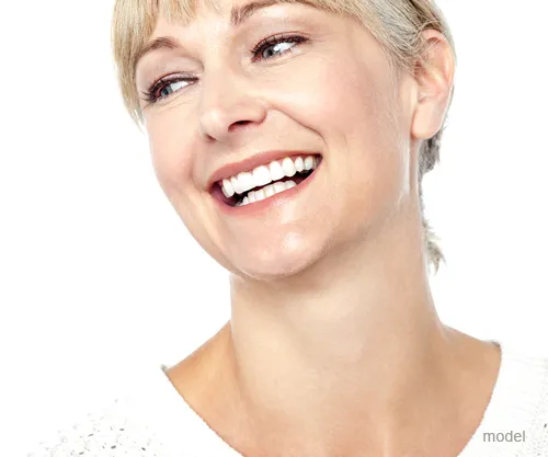 woman smiling showing a neck lift
